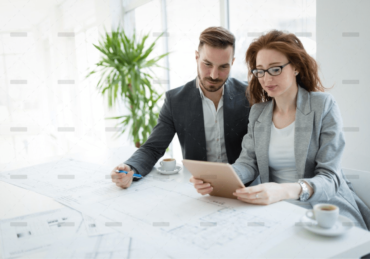 demo-attachment-877-portrait-of-young-architect-woman-on-meeting-KFZCE3A